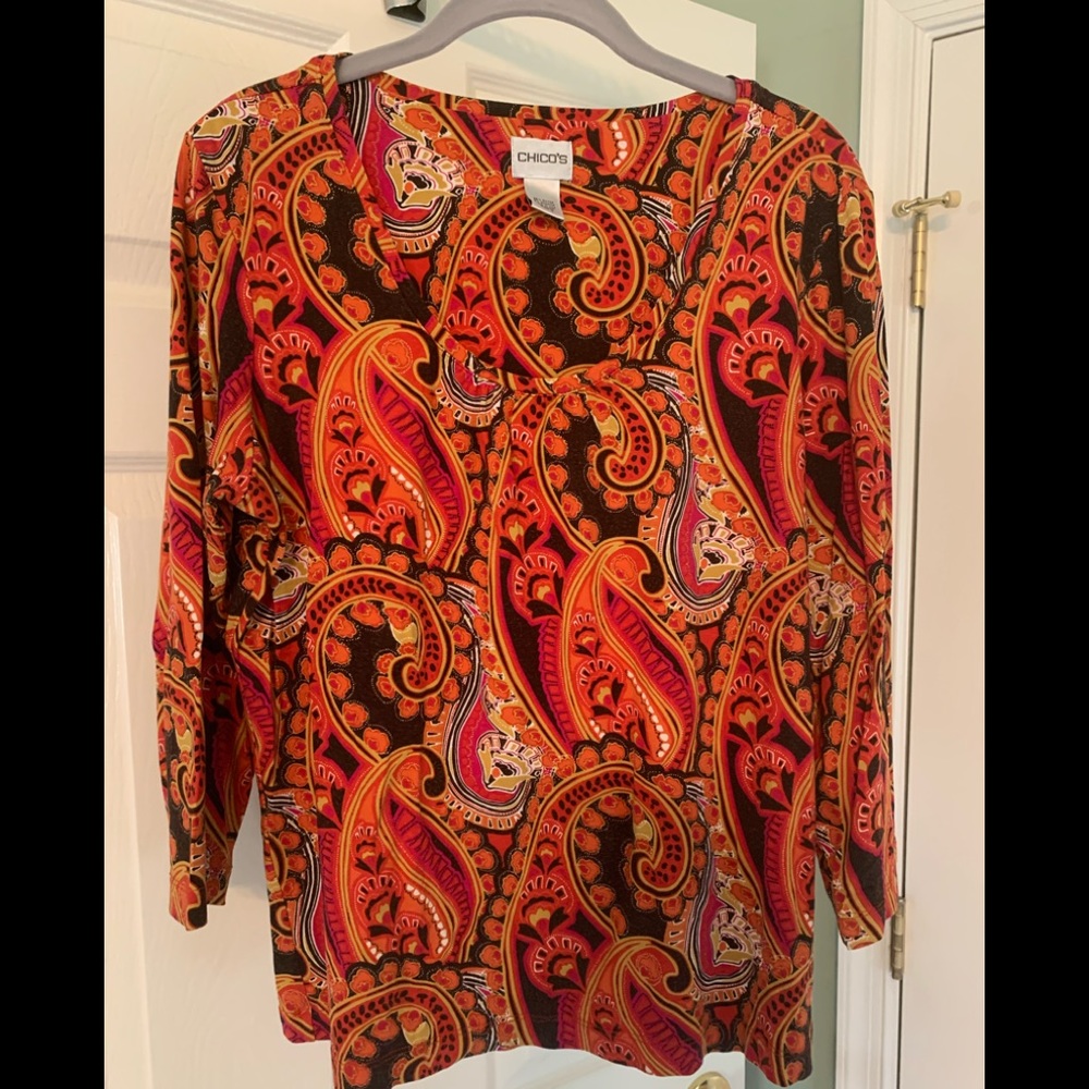 Chico’s orange and pink top.